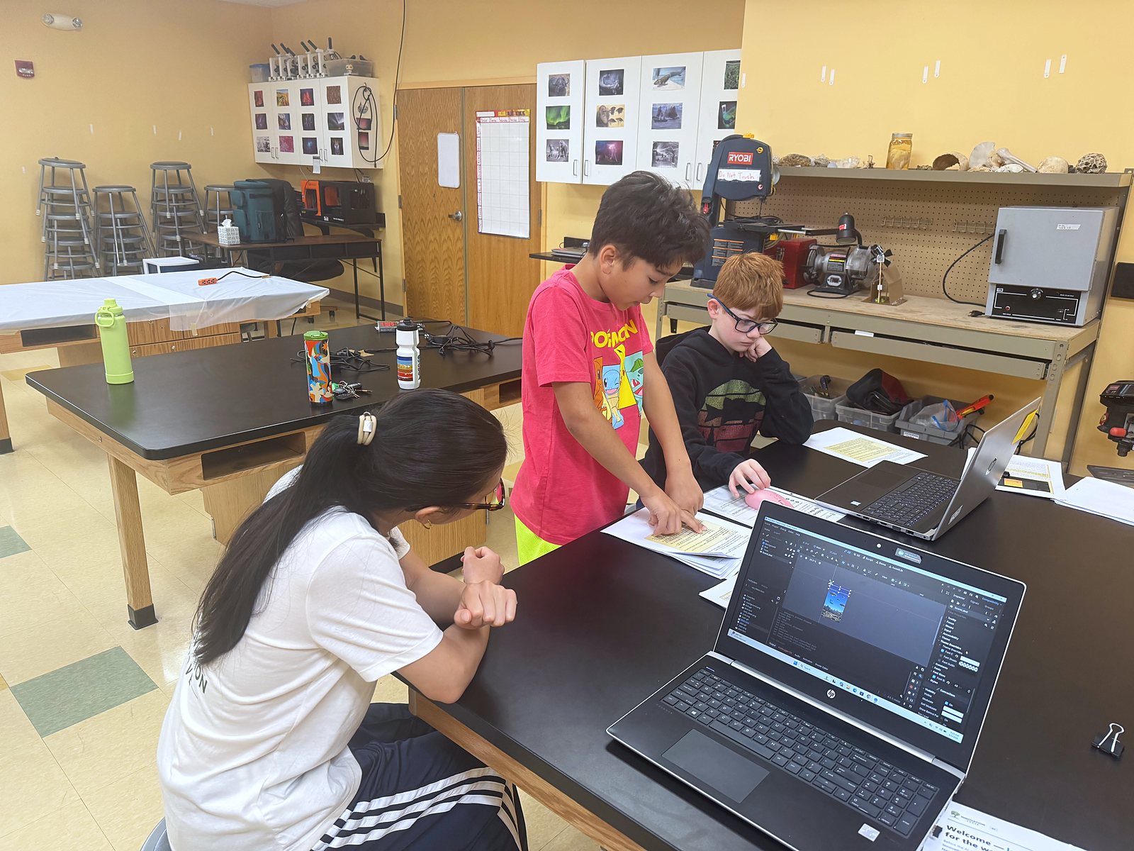 Students working through their Game Time build at the lab bench